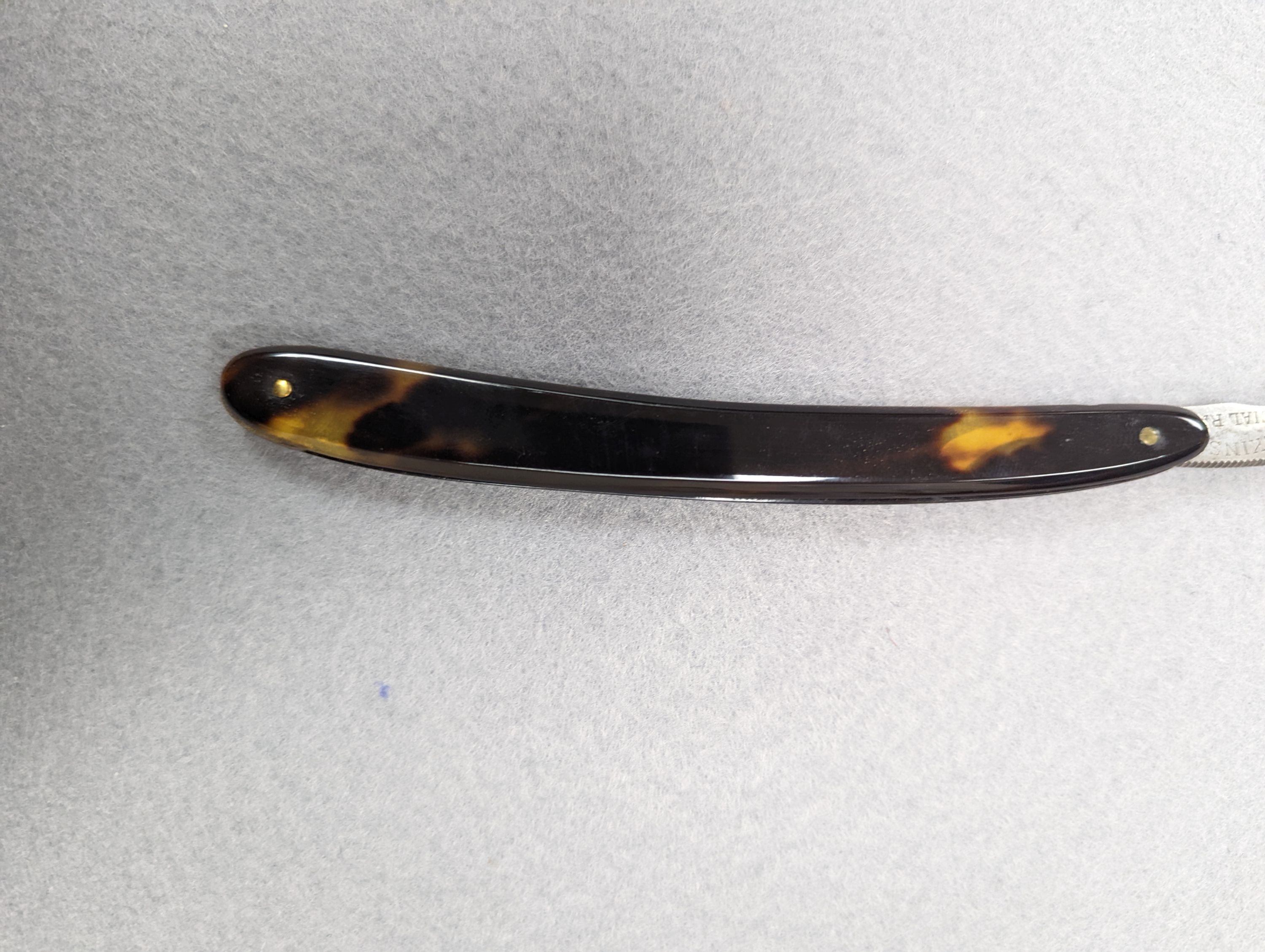 A set of seven tortoiseshell handled cut throat razors for the days of the week Wilkinson and a cased pair of tortoiseshell handled razors, C&W Higginbottom